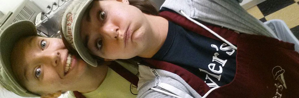 Girls serving ice cream to customers